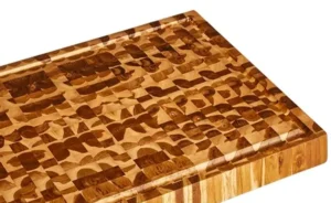 Close-up of end grain construction on medium teak cutting board, showing durable wood fibers and self-healing surface.