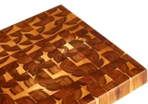 Close-up of end grain construction on square acacia cutting board, showing durable wood fibers and self-healing surface.