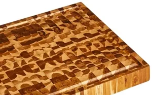Close-up of end grain construction on medium teak cutting board, showing durable wood fibers and self-healing surface.